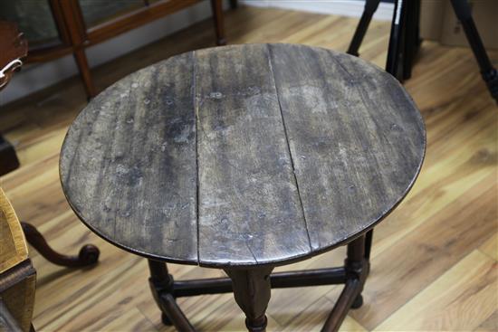 An 18th century circular fruitwood and oak cricket table, W.2ft 2in.